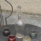 Liqueur carafe, or aperitif, carved with floral decoration in transparent glass and 4 polka dot glasses