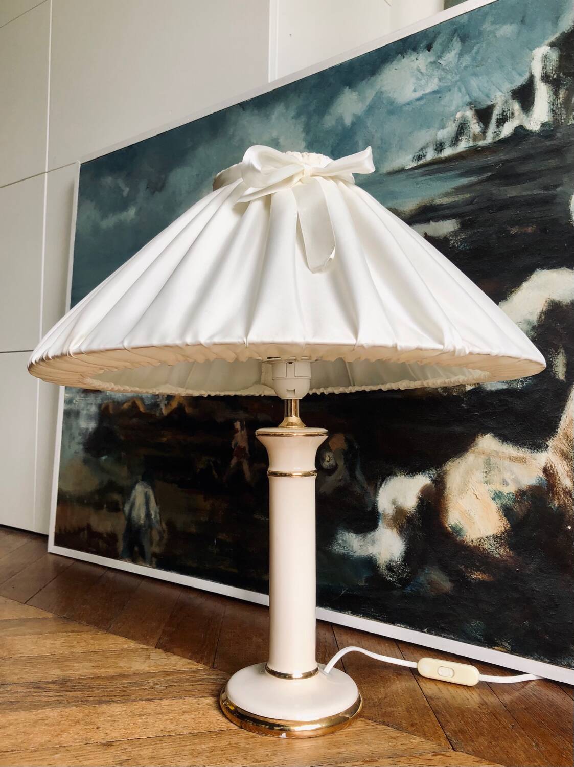 Vintage ivory ceramic lamp with gilding.