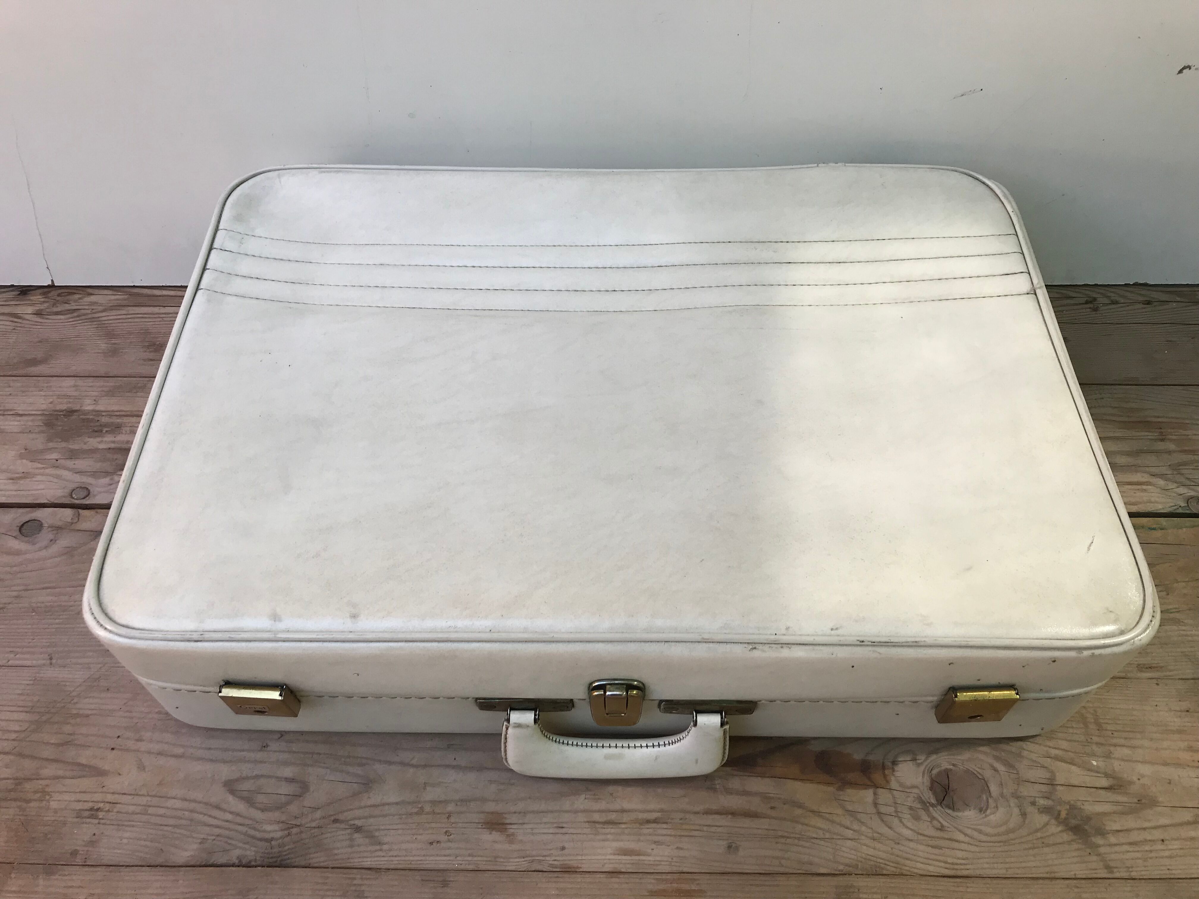 Old white leather case with vintage 70s leather handle