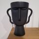 Black tribal face vase