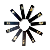 Set of 11 blackened resin knife holders, 1970s