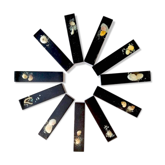Set of 11 blackened resin knife holders, 1970s