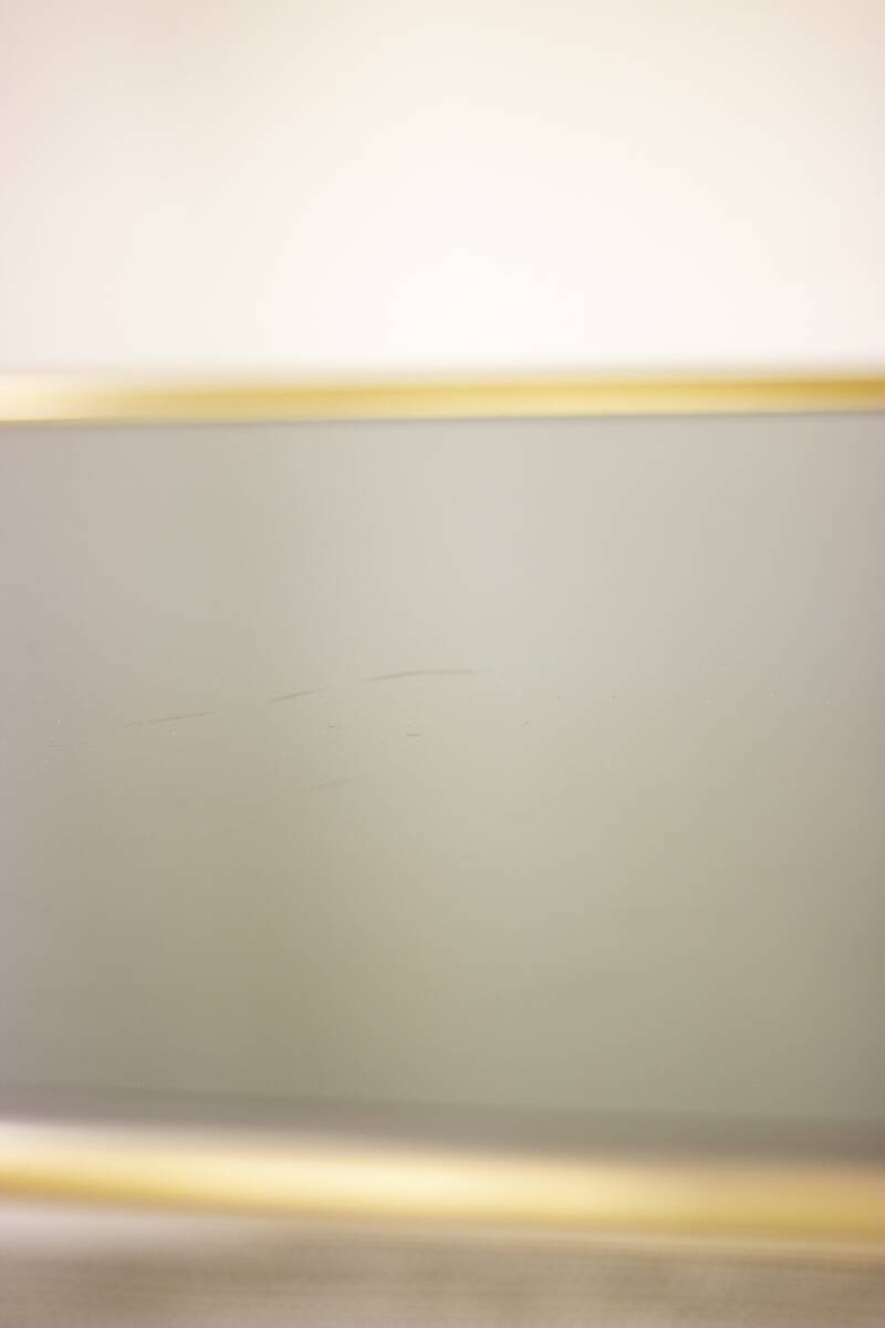 Gold metal and smoked glass server