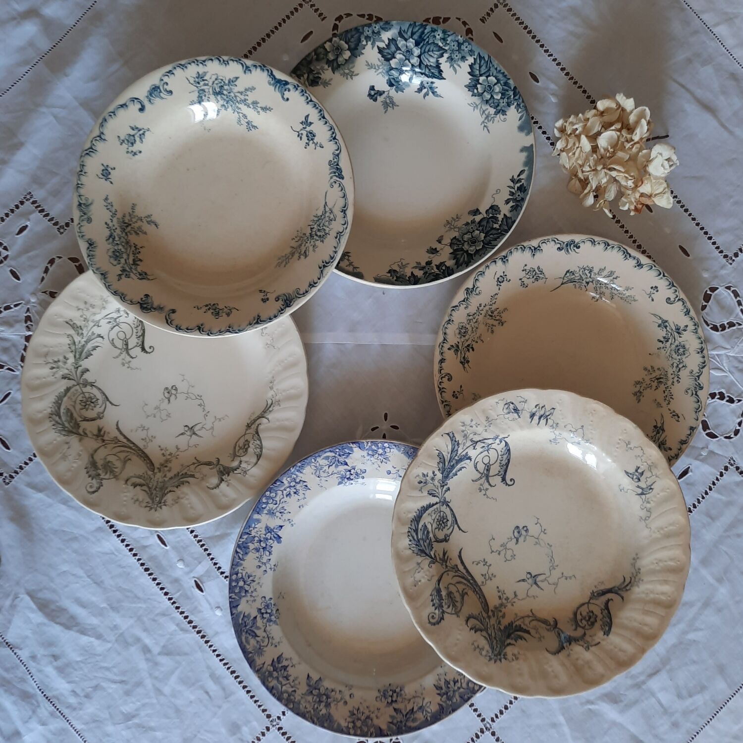 Old mismatched hollow plates in iron earth earthenware