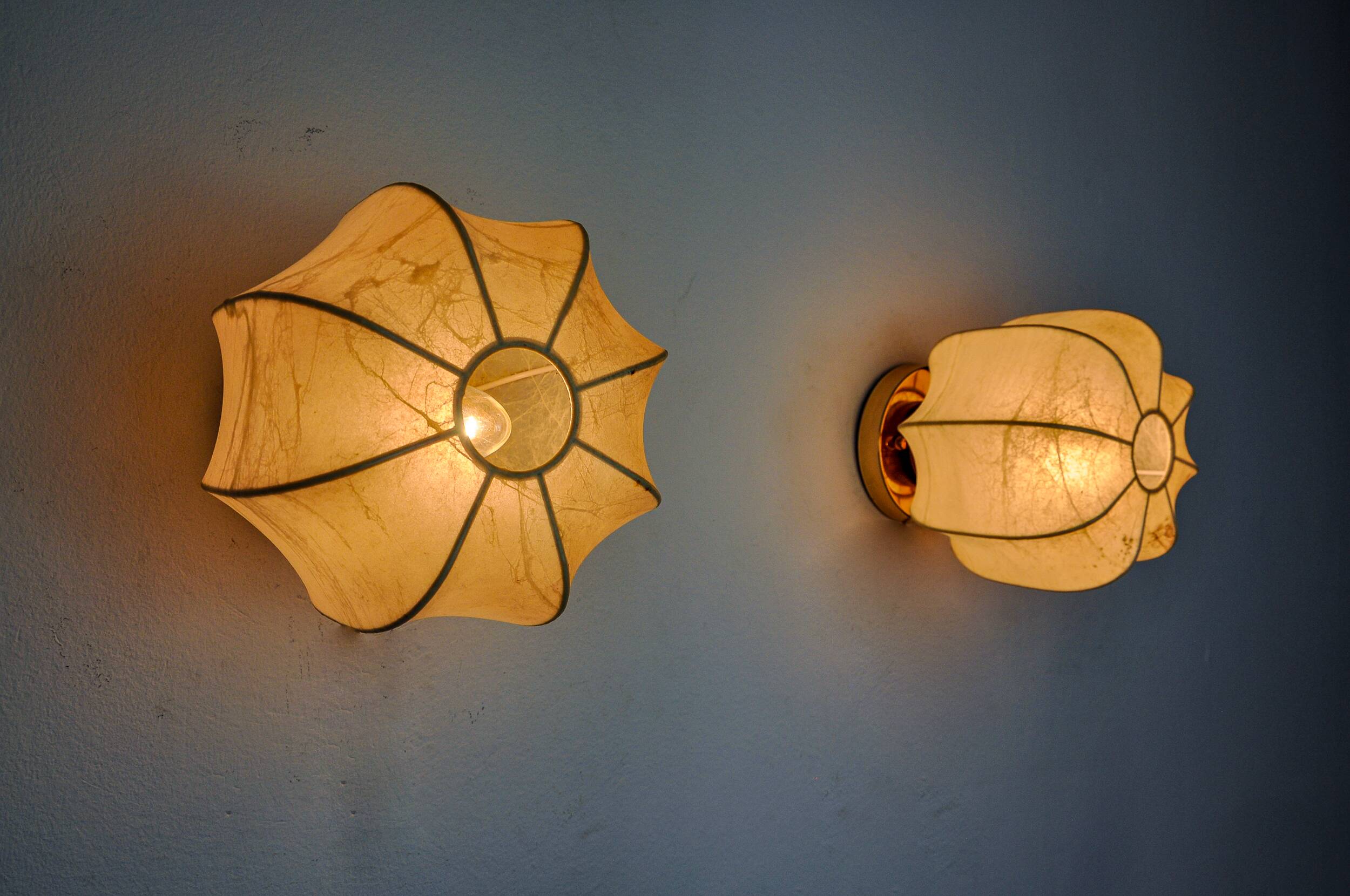 Pair of “cocoon” wall lights, resin and pine, italy, 1970
