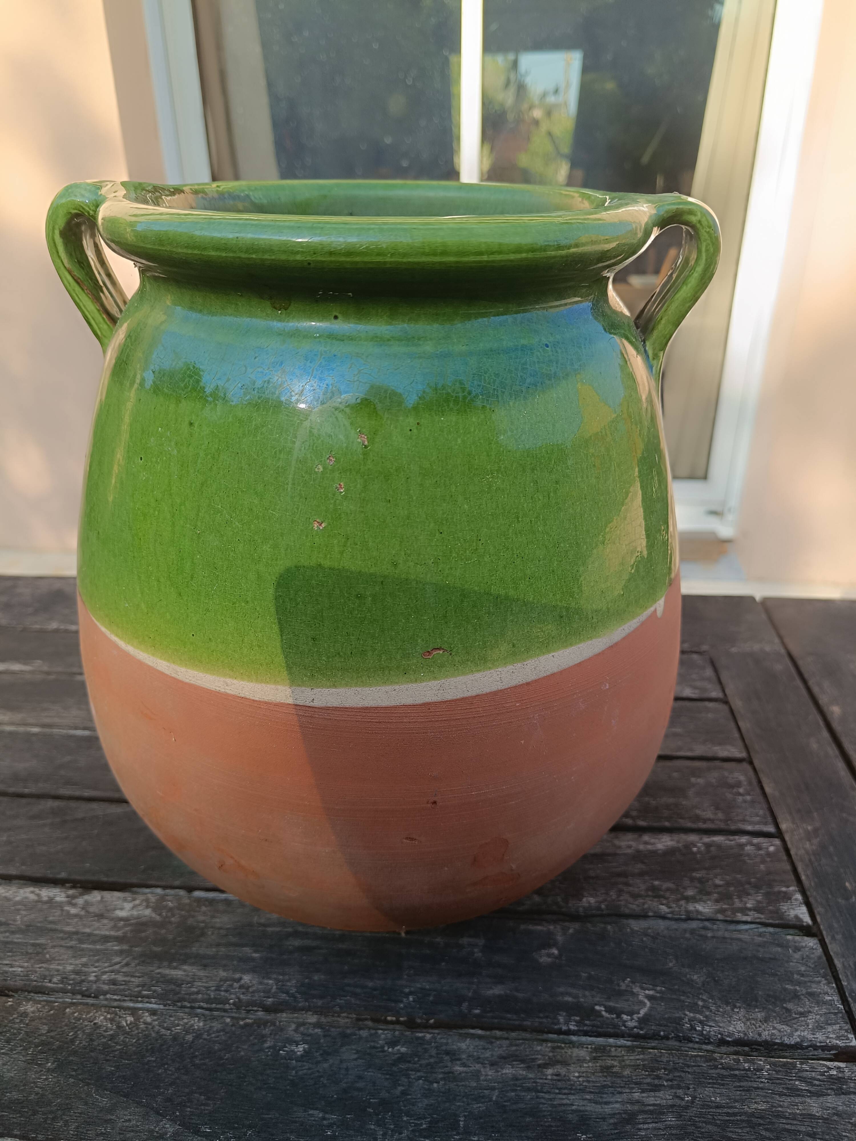 Mediterranean pot in green half-glazed terracotta.