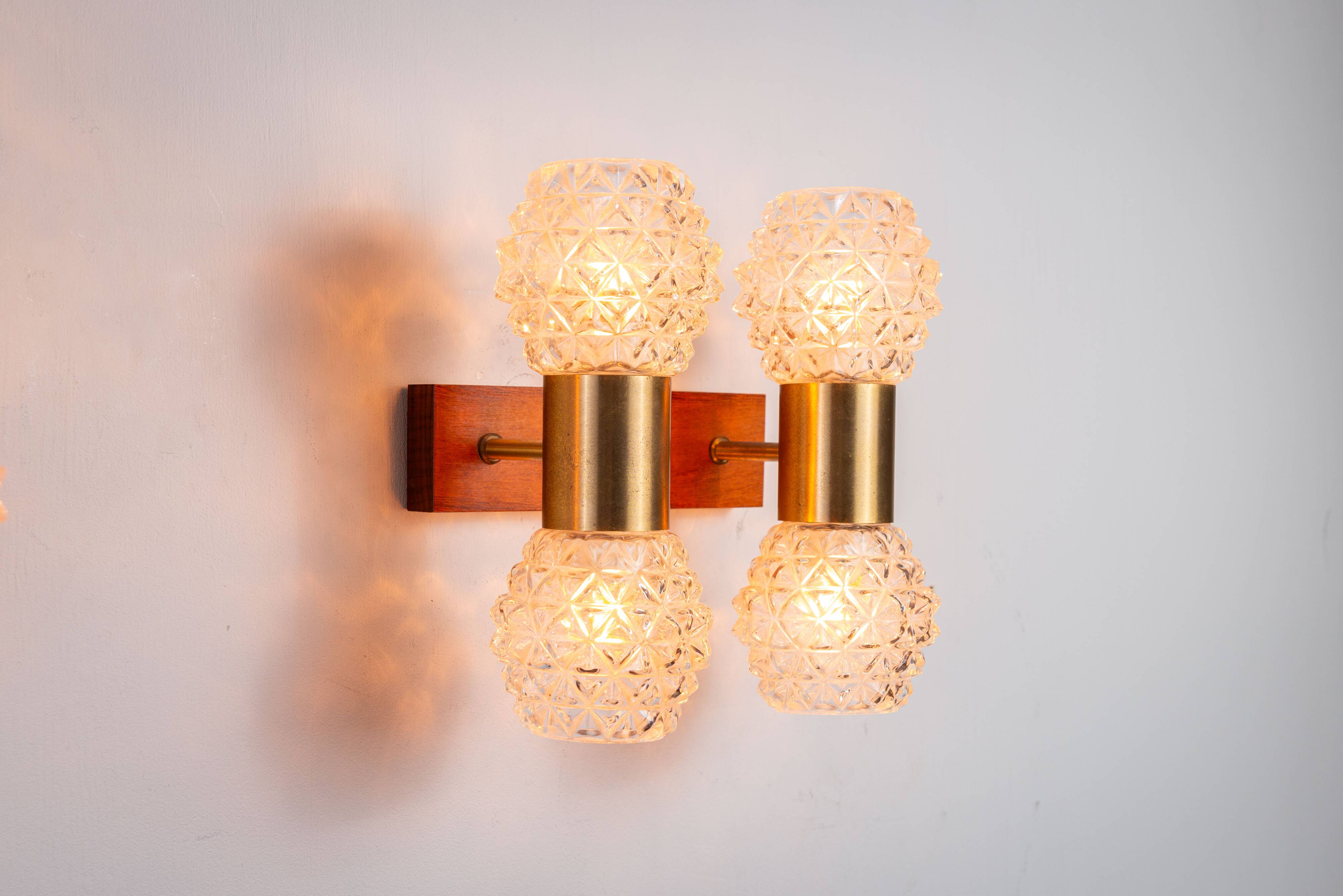 Pair of Swedish wall lamps with teak wood, brass and glass cup shade