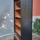 Two-tone black and honey bookcase