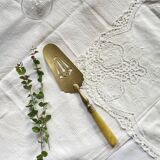 Pie server cake dessert in gold metal vintage silverware yellow bakelite handle