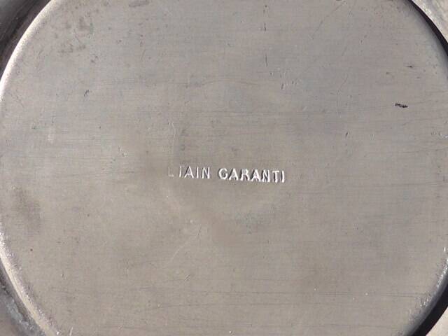 Pewter vase with vine decoration, 1930