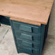 Antique desk with drawers and shelf