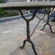 Old bistro table in marble and godin cast iron foot