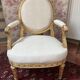 Large cabriolet armchair in Louis XVI style with gilded wood.