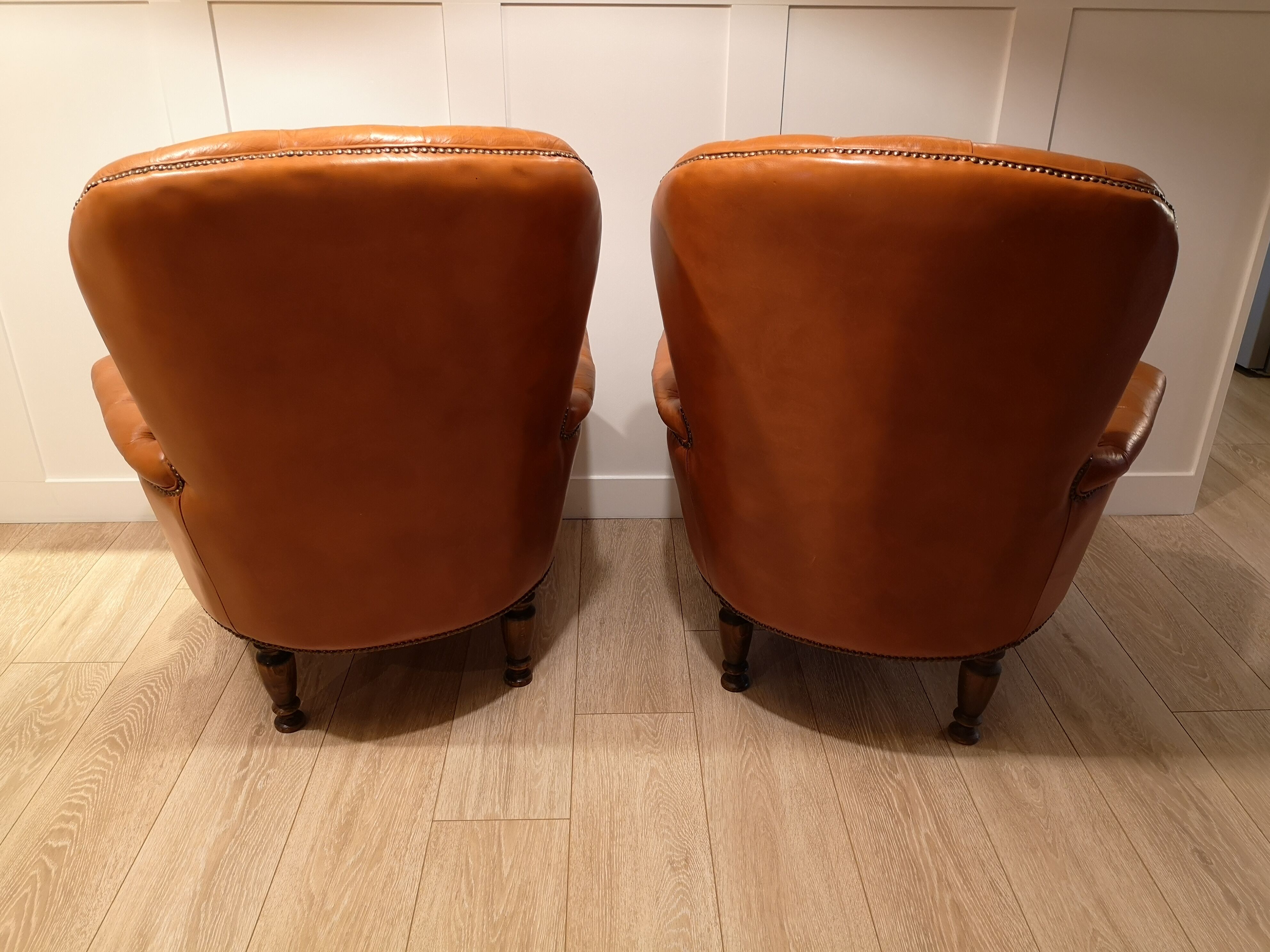 Pair of leather chesterfield chairs