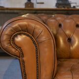 Fawn-colored tufted Chesterfield sofa