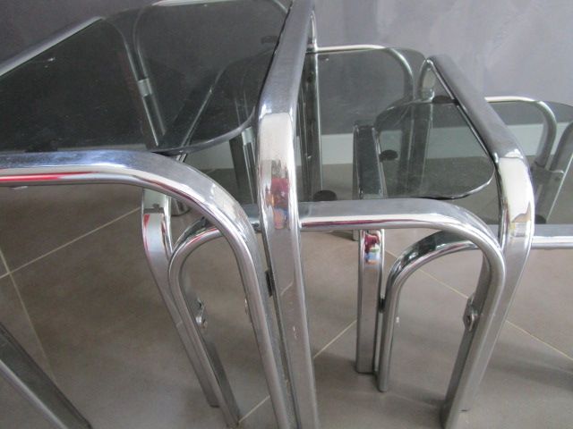 3 Vintage trundle tables in chromed steel and smoked glass