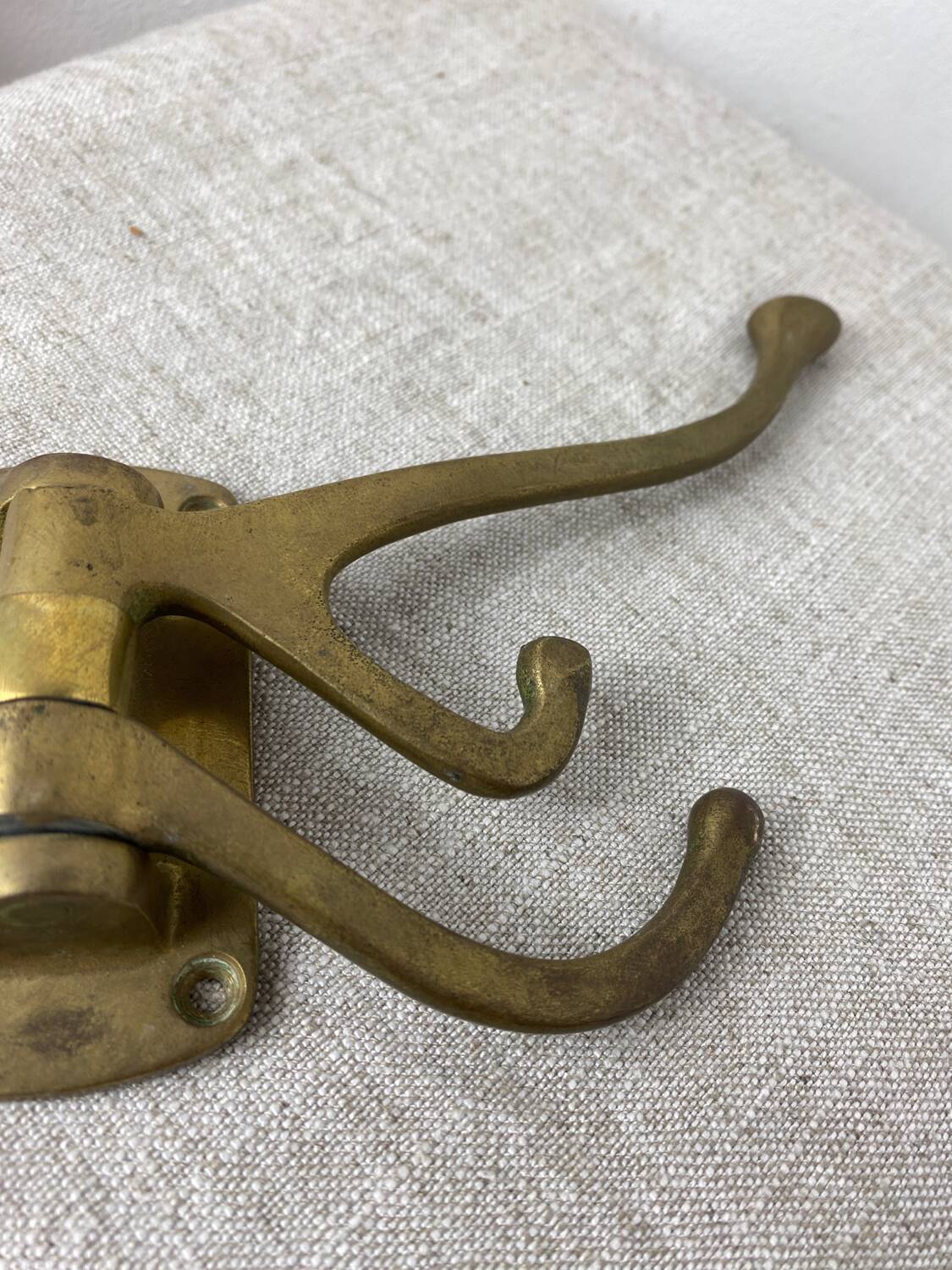 Three-pronged folding brass coat hook