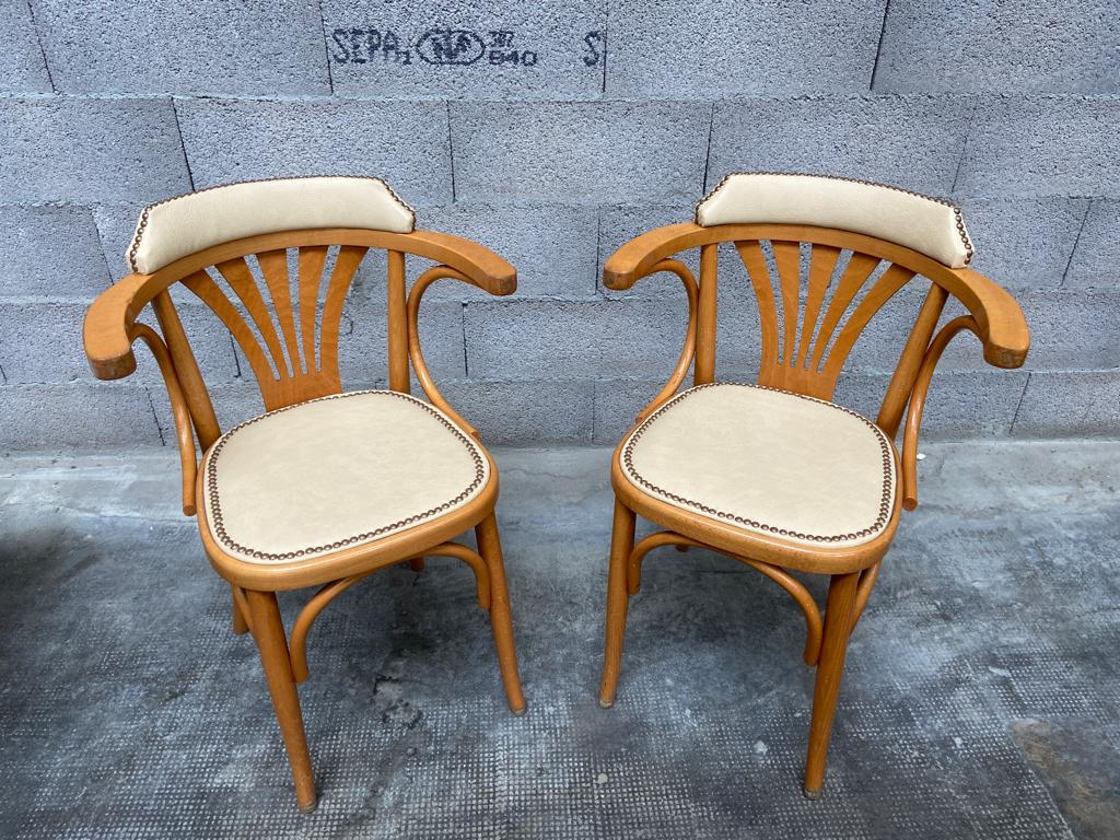 Pair of vintage curved wood restaurant armchairs