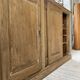 Large row of solid oak loom sliding doors