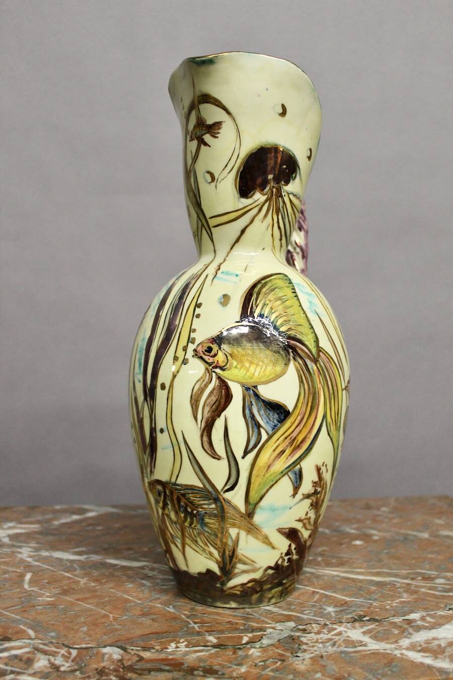 Ceramic jug with fish decoration
