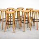 8 mid-century modern bar stools in beech and hammered iron.