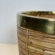 Rattan and brass wastepaper basket in the style of Gabriela Crespi.