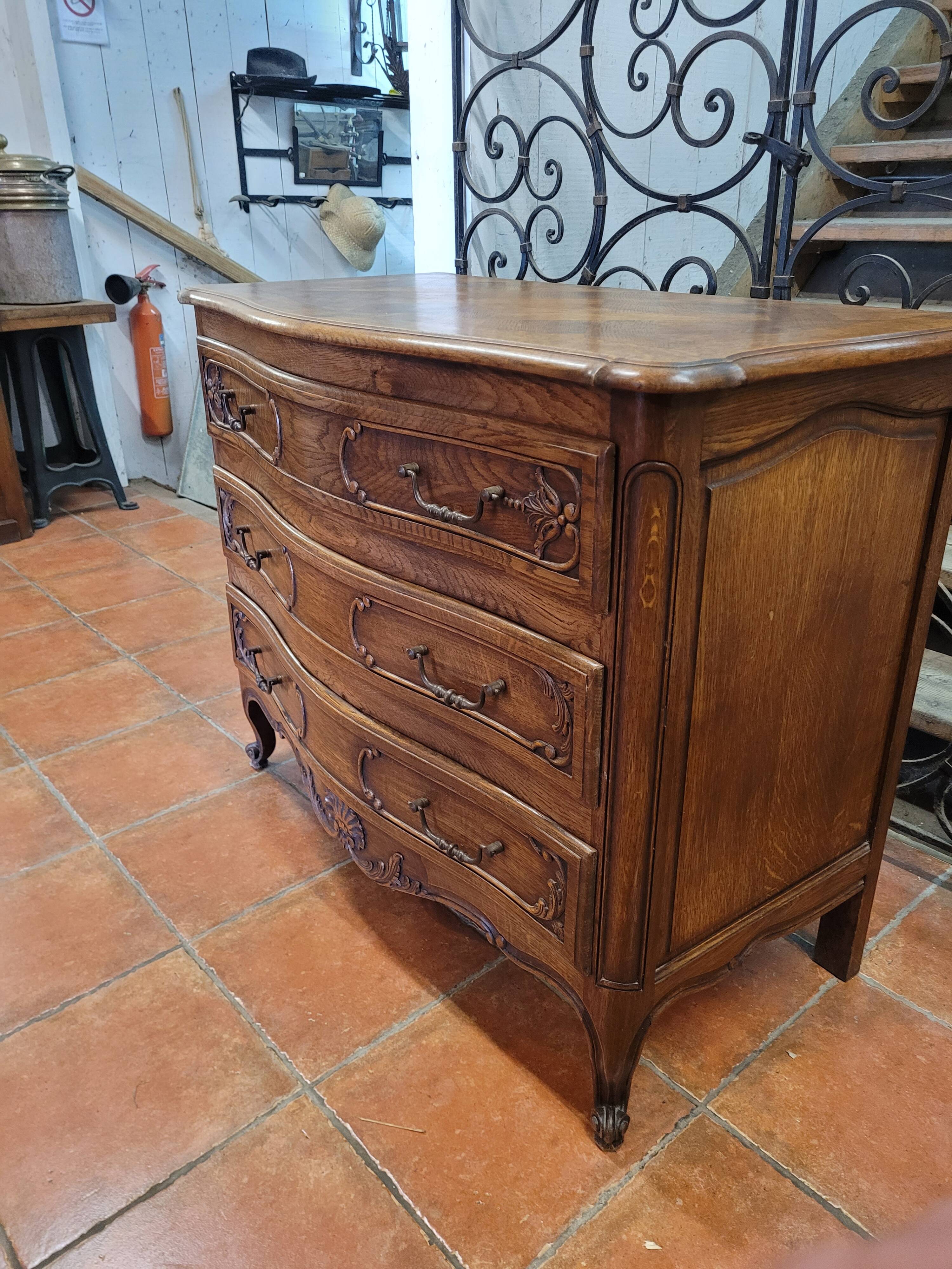 Curved oak chest of drawers in Louis XV style