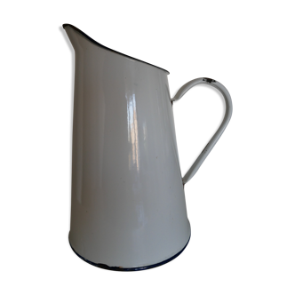 White enamelled metal broc