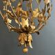 Important golden iron lantern with foliage decorations from the Baguès house.