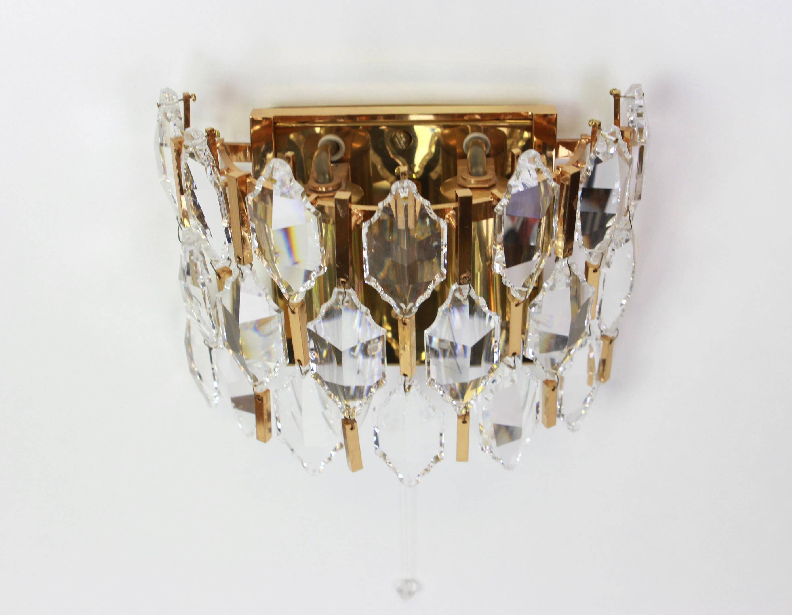 Pair of wall sconces in gilded brass and crystal by Palwa, Germany, 1970s.