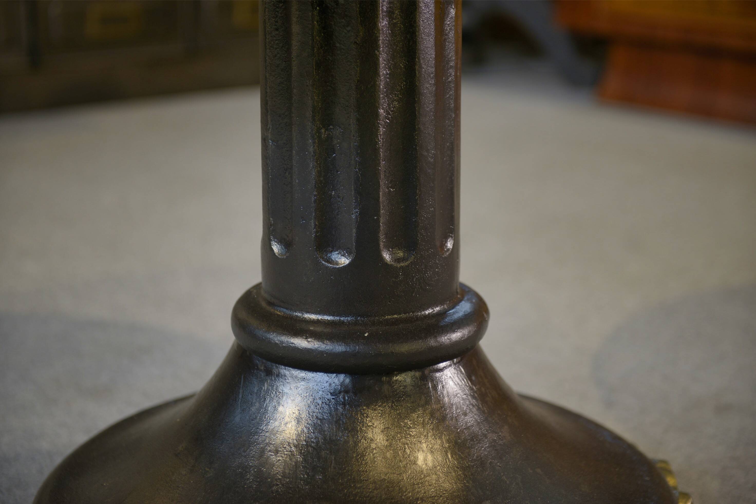 Neo-classical cast iron and glass eglomisé coffee table from the 1940s.