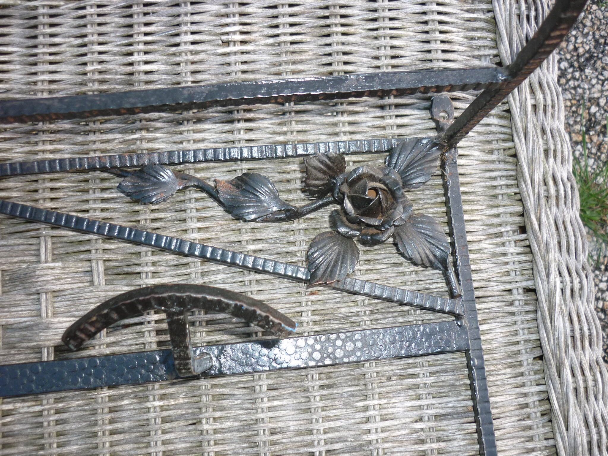Wrought iron vest and a shelf with a hat