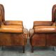 Set of 2 beautiful and correct sheep leather wingback armchairs with fixed seat cushions