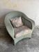 Vintage wicker lounge chair with pastel cushions – 1980s