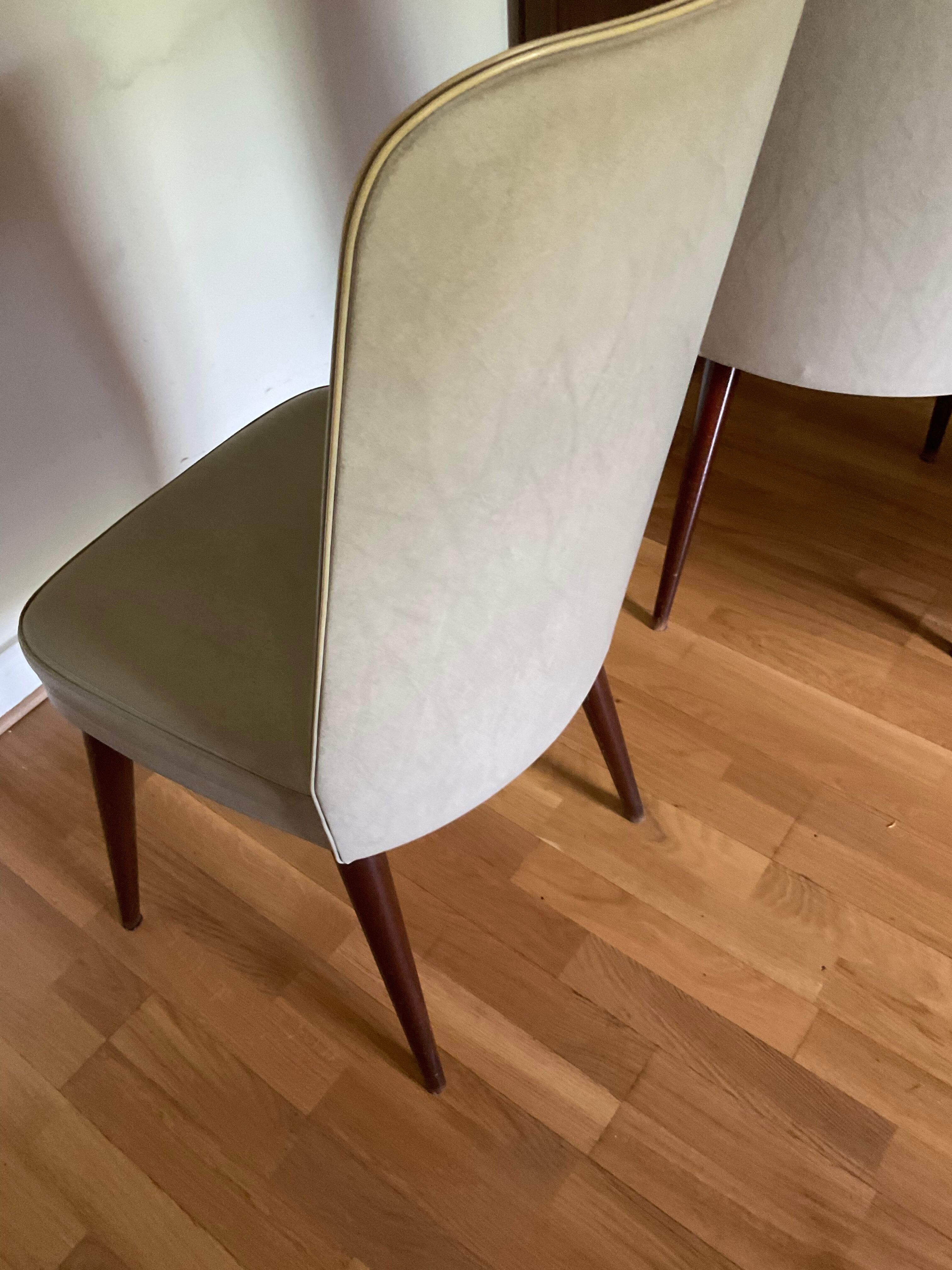 Pair of vintage mahogany and skai chairs