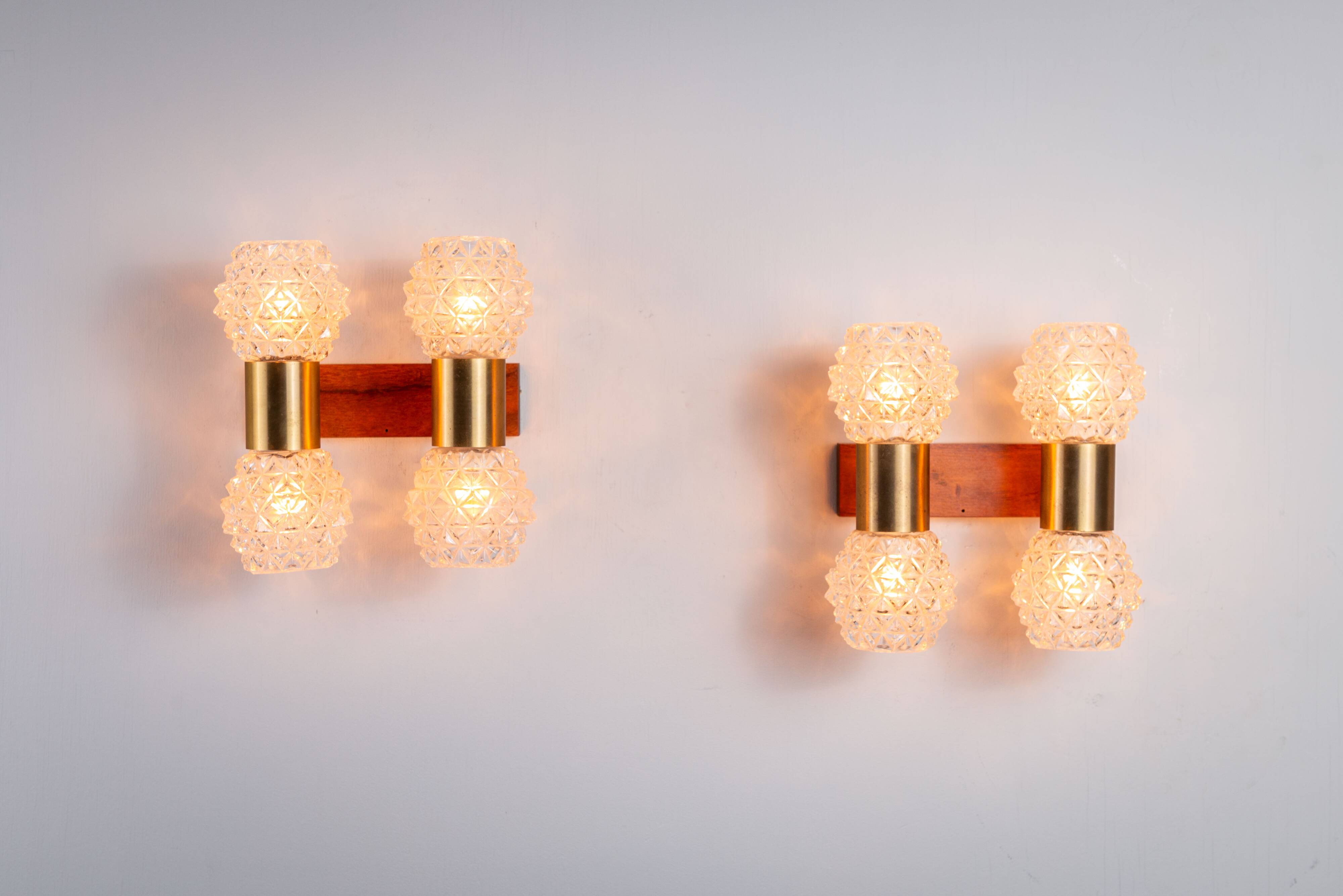 Pair of Swedish wall lamps with teak wood, brass and glass cup shade