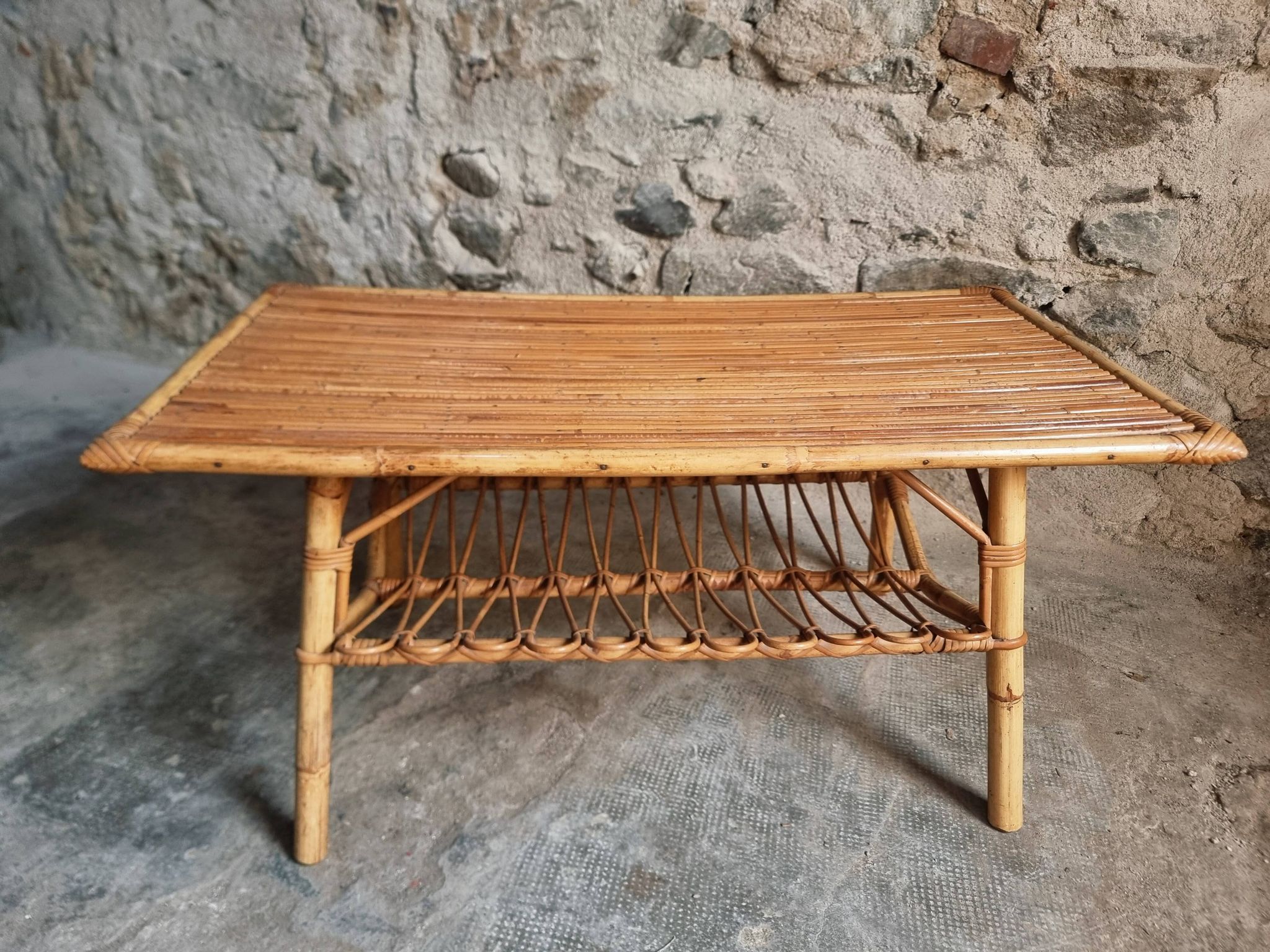 Vintage bamboo and rattan coffee table with magazine rack, French, circa 1960–1970.