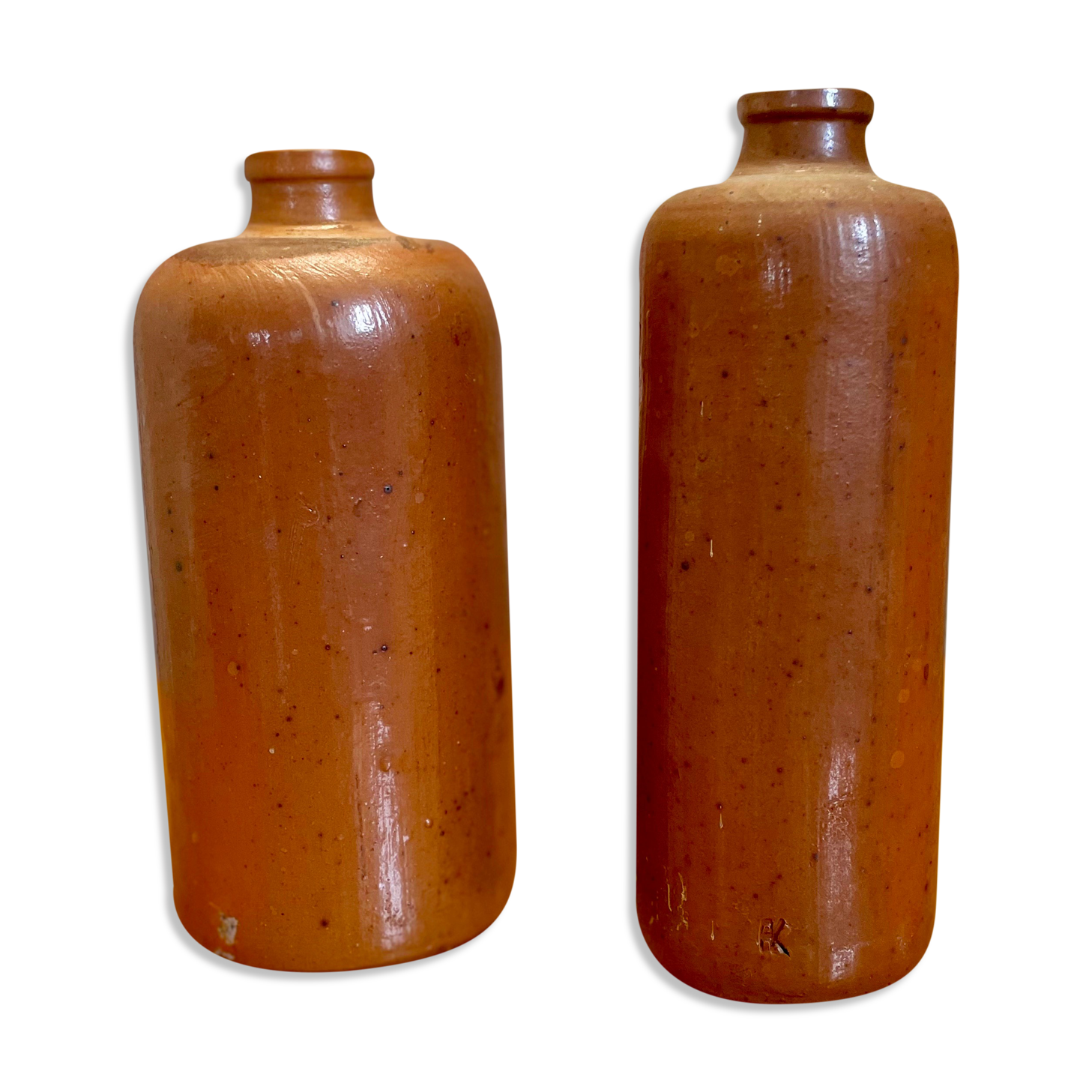 Set of two bottles or jugs in ocher-brown enamelled sandstone