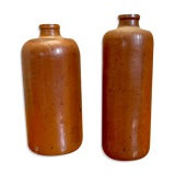 Set of two bottles or jugs in ocher-brown enamelled sandstone