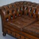 Restored vintage leather Chesterfield canapé in Thomas Chippendale style.