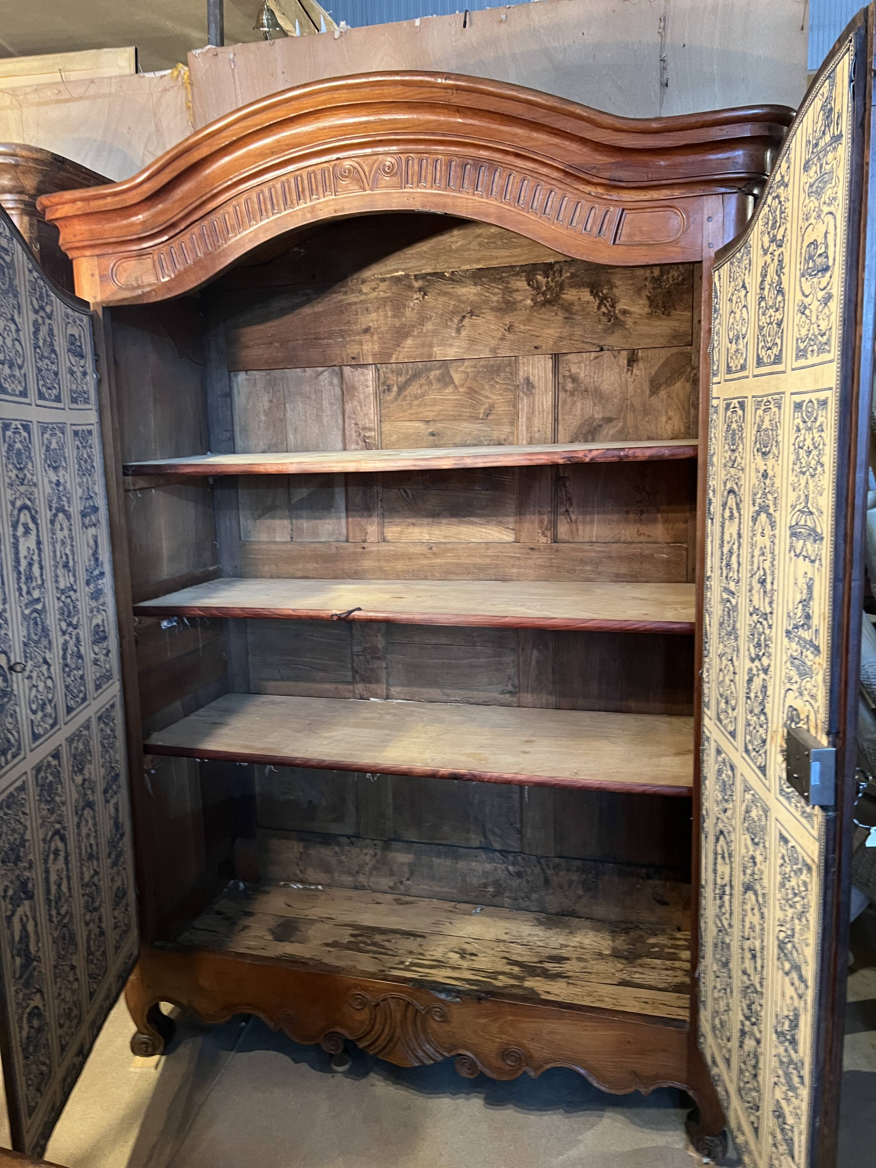 Louis XV wardrobe with two doors, Cherry wood. 18th century.