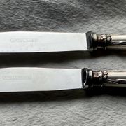 Set of 12 silver-plated metal table knives in Art Nouveau style.