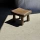 Small stool, square solid teak side table with a curved seat.