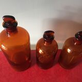 3 old pharmacy vials
