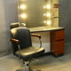 Spotlight hairdresser and her vintage barber chair
