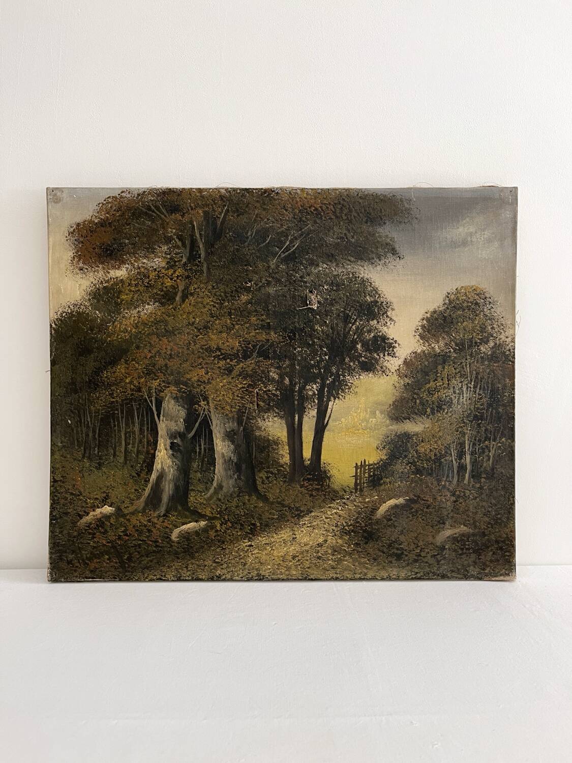 Old oil painting on canvas of a forest landscape.