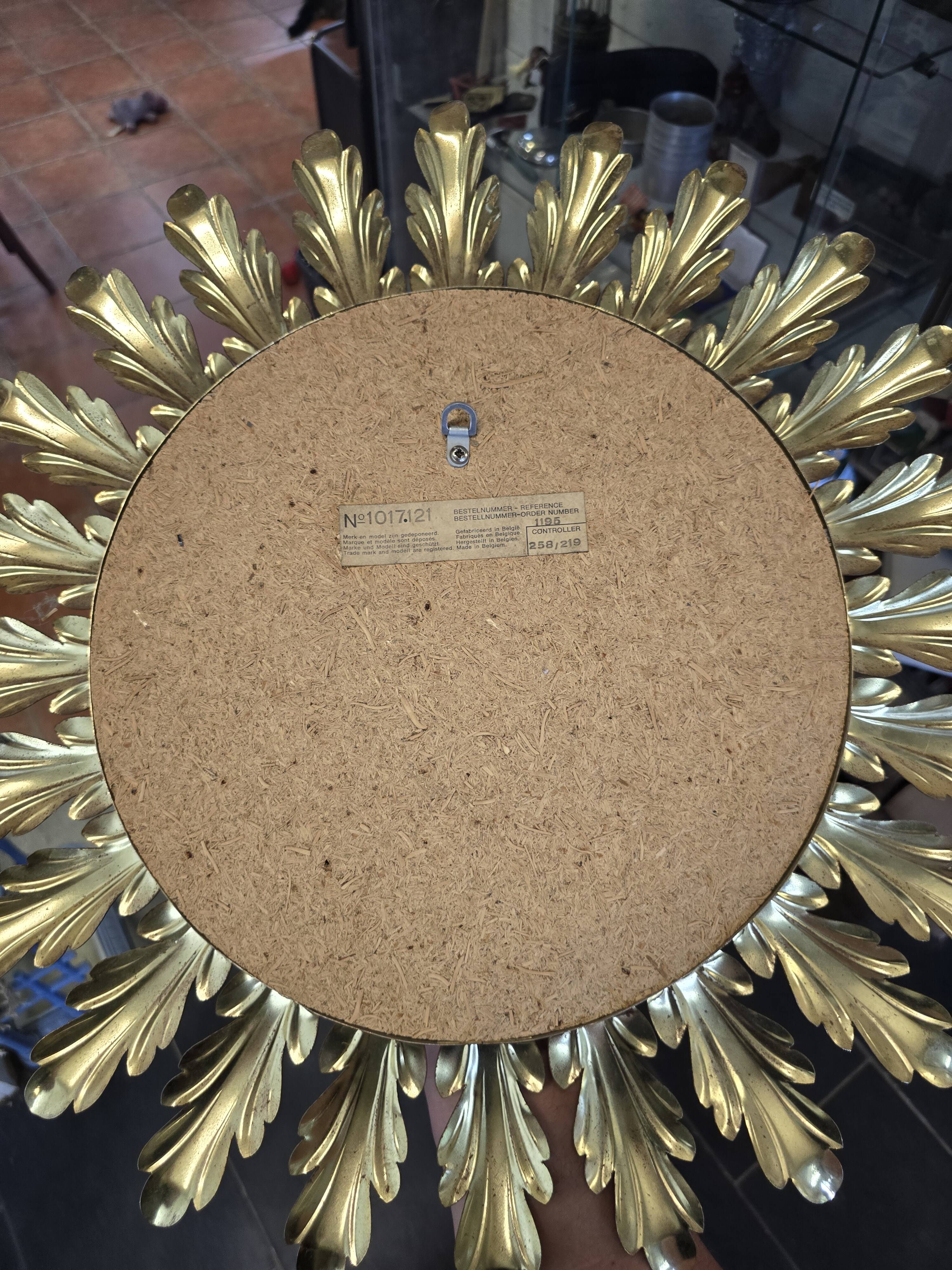 Witch's eye sun mirror in gold metal from the 60s
