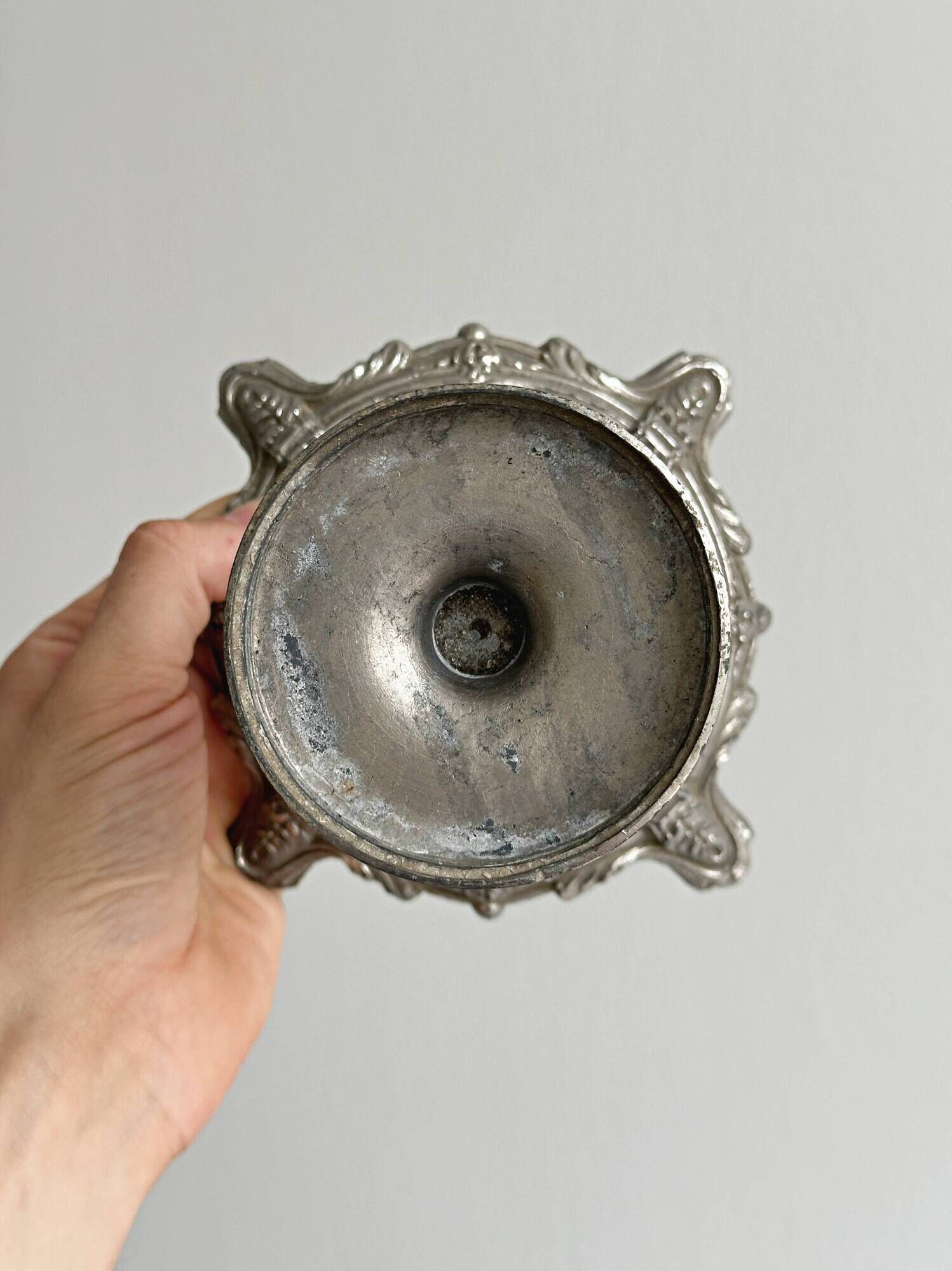 Candle holder with sculpted metal base, antique.