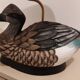 Decorative table lamp with a sculpted duck-shaped base and painted finish.