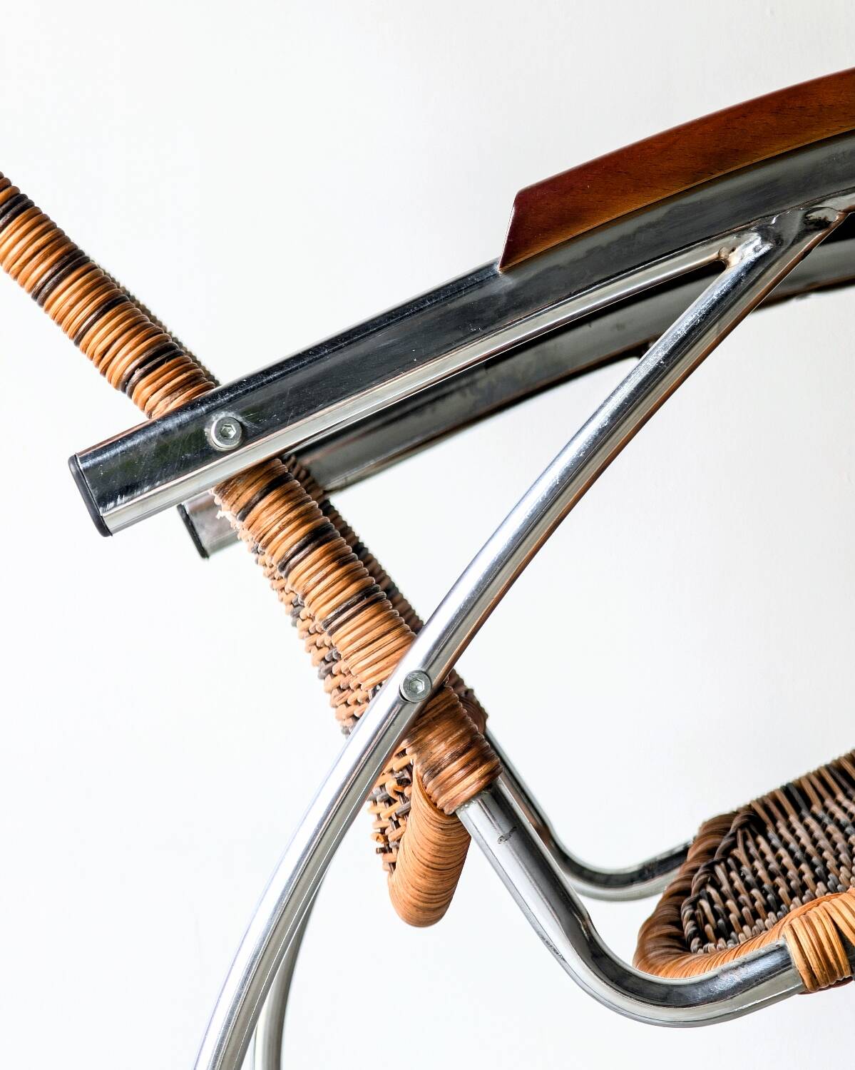 Vintage Thonet rocking chair in chrome and rattan, 1970.